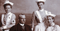 Portrait of a male doctor with three female nurses
